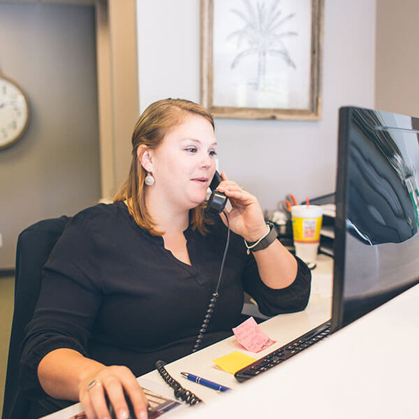 Our Palms Dentistry receptionist answering an emergency dentistry call 