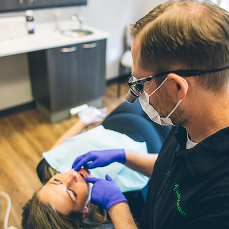Our dentist in Simpsonville working with a patient